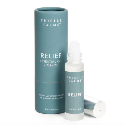 Thistle Farms Relief essential oil roll-on bottle and packaging on a white background
