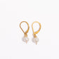 14k gold filled leverback earrings with freshwater pearls on a white background