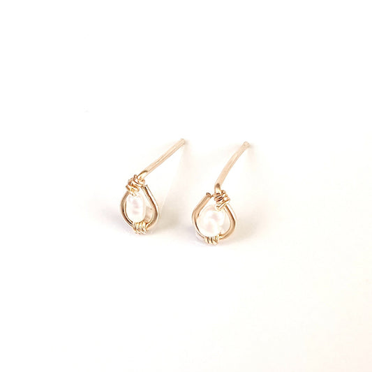 Freshwater rice pearls centered in 14k gold filled stud earring.
