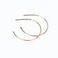 simple gold hoop earrings on a while background