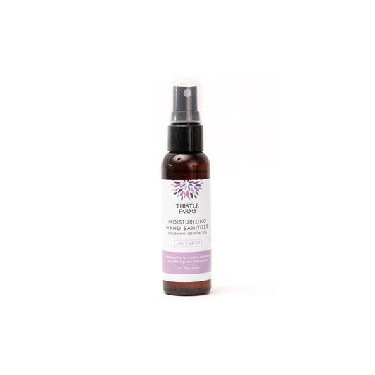 Thistle Farms moisturizing hand sanitizer bottle on a white background