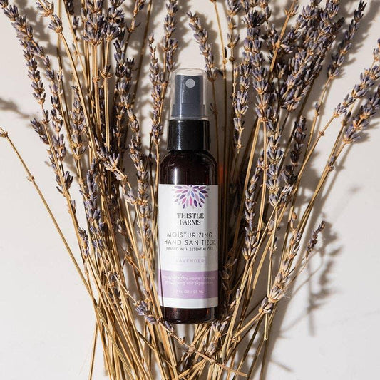 Thistle Farms moisturizing hand sanitizer bottle on a white background
