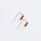 tiny gold threader earrings with four red glass seed beads