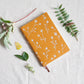 Layflat embroidered floral journal notebook that supports schools. 