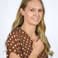 model wearing mixed sterling silver and gold bracelets, necklaces and earrings