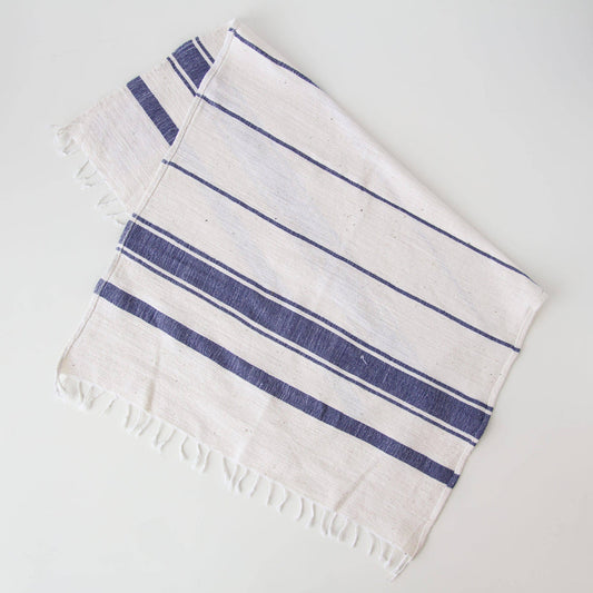 White towel with blue stripes on a light gray background