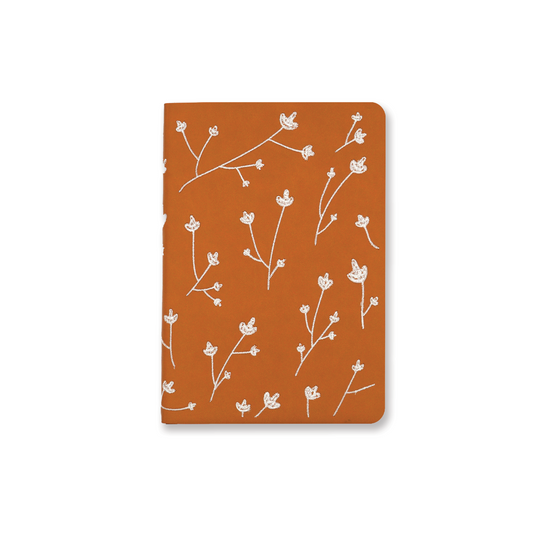 Layflat embroidered floral journal notebook that supports schools. 