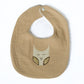 tan baby bib with owl design on a white background