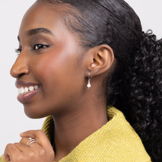 Woman wearing leverback Leeda Freshwater Pearl Drop Earring in Sterling Silver. Classic. Minimalist.