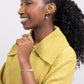 Woman in a yellow sweater wearing leverback Leeda Freshwater Pearl Earrings  and Bracelet in Sterling Silver. Classic. Minimalist.