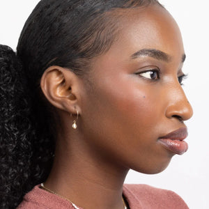Woman wearing Mini-hoop Freshwater Pearl Charm Earrings.