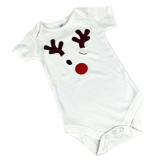 White baby onesie with winking red-nosed reindeer, hand-appliqued.