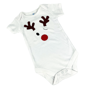 White baby onesie with winking red-nosed reindeer, hand-appliqued.