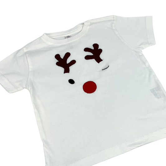 Festive white toddler tee featuring winking reindeer with red nose, hand-appliqued. 