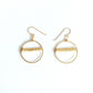 Samira Seeds of Hope Earrings in 14k Gold Filled feature a brass hoop with cream and gold seed beads hanging from 14k gold filled fishhook ear wires