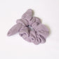 a lavender scrunchie made of double cotton gauze on a white background