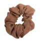 A handmade cocoa brown linen scrunchie unstretched, showing its solid color and texture.