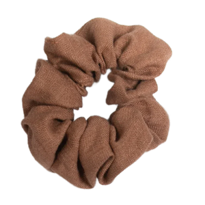 A handmade cocoa brown linen scrunchie unstretched, showing its solid color and texture.