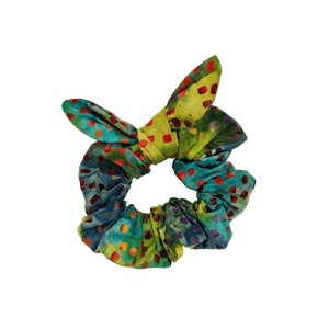 Handmade multicolored fiesta batik cotton scrunchie on white background