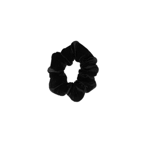 A handmade black velvet scrunchie on a white background.