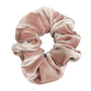 A handmade rose gold velvet scrunchie.