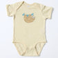 Beige baby onesie with a sloth design on a white background