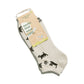 Beige sock with black cat illustrations and a visible brand label on a white background