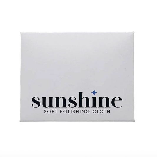 Sunshine brand soft yellow polishing cloth in white envelope on a white background
