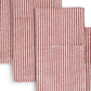 Close up of red and white striped cloth napkinson a white background