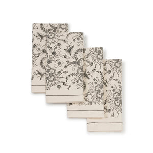 set of four beige cloth napkins with gray block printed floral pattern