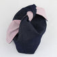 a denim and pink gingham makeup bag that ties at the top
