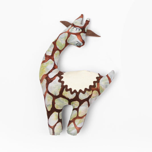 A handmade giraffe tooth pillow  plushie featuring a secret saddle pocket for tiny treasures.