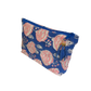 Blue block print zipper pouch with pink roses on bright blue background.