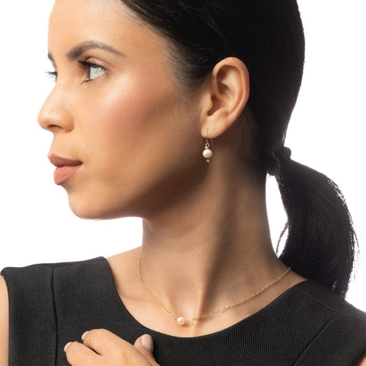 Sideview of woman wearing the Leeda Freshwater Pearl Earrings and Necklace in 14k Gold Filled