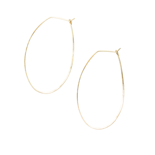 Sideview of woman wearing Azmera Hammered Hoop Earrings in 14k Gold Filled 