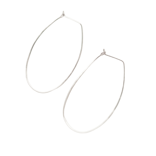 Sideview of woman wearing Azmera Hammered Hoop Earrings in Sterling Silver 
