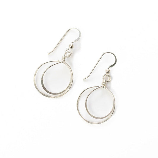 Zomi Circles of Unity Earrings in Sterling Silver on woman's ear.