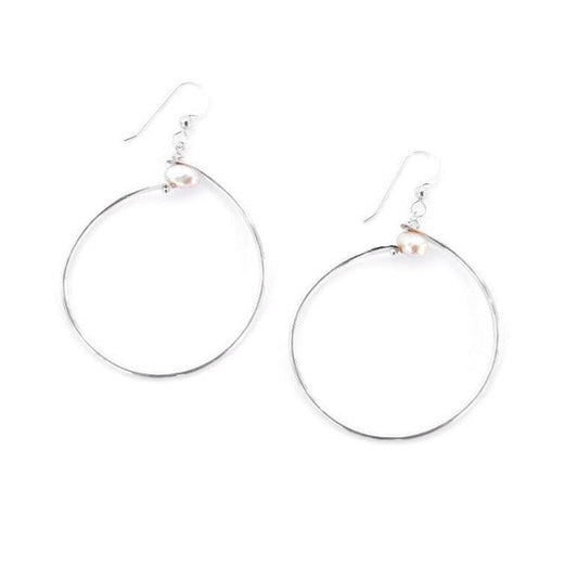 Sideview of young woman wearing Rose and Hoop Pearl Earrings in Sterling Silver