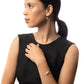 Sideview of woman in black wearing Leeda Freshwater Pearl Earrings, Necklace and Bracelet in 14k Gold Filled