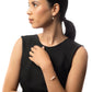Woman in pony tail wearing the Leeda Freshwater Pearl Necklace, Bracelet, and Earrings in 14k Gold Filled. 