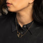 Zomi Circles of Unity Necklace and Earrings in 14k Gold Filled worn by young woman in black blouse.