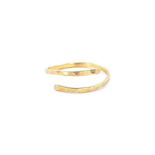 Woman wearing Hand-Hammered Wrap Ring in Brass holding a white cup