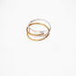 Hand-Hammered Sterling Silver and Brass Wrap Rings stacked together for a mixed metal look.