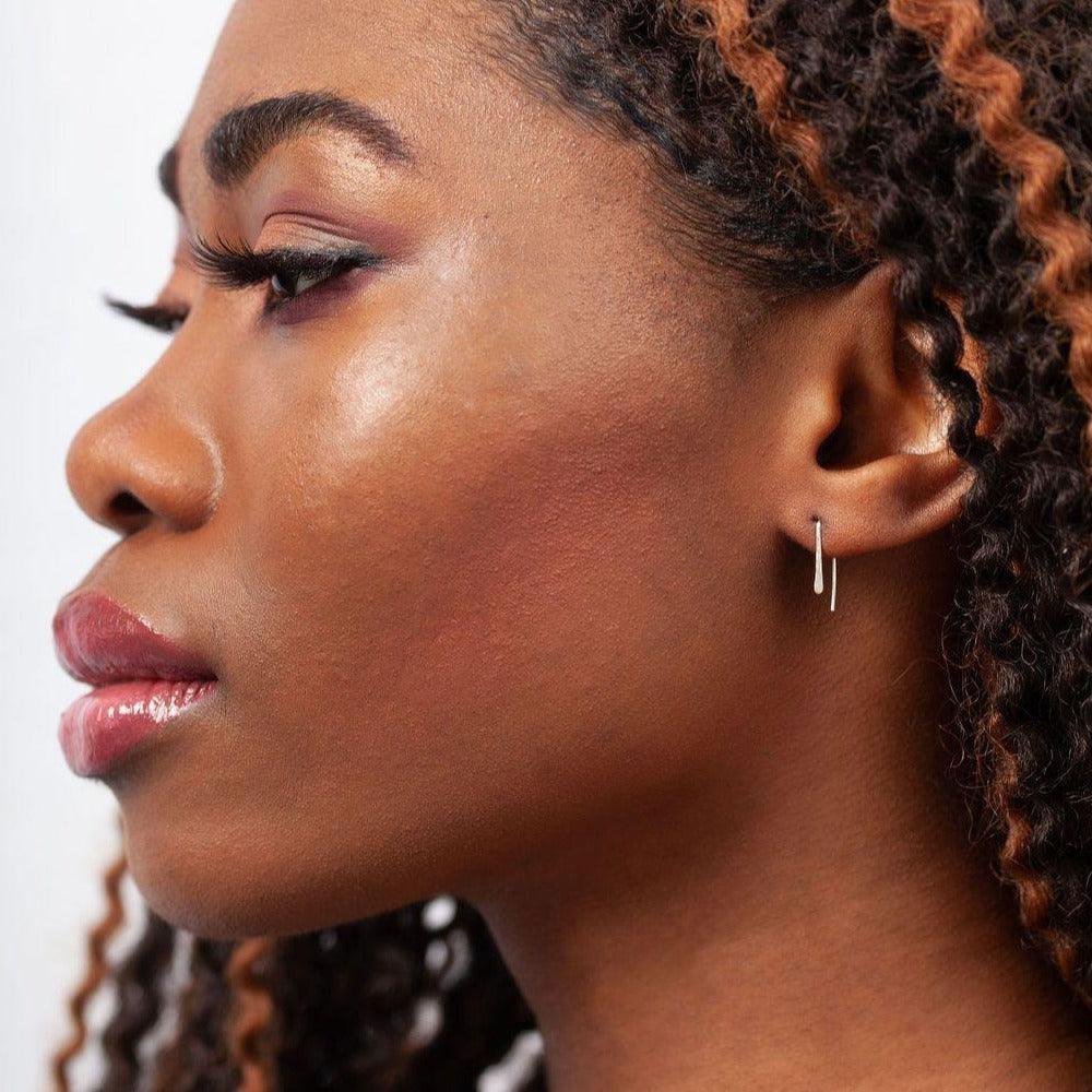 Woman wearing Indra Staple Threader Earrings in Sterling Silver. Minimalist